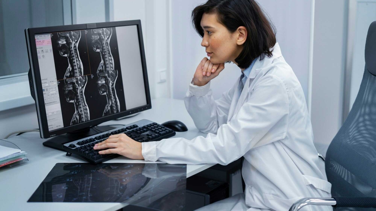 doctor-looking-ct-scan_23-2149367466_optimized